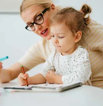 Portrait of Mother and Daughter Drawing With Colouring Pens